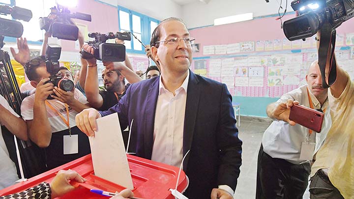 Tunisian Prime Minister Youssef Chahed casts his ballot for presidential election at a polling station in La Marsa on the outskirts of the capital Tunis on Sunday.