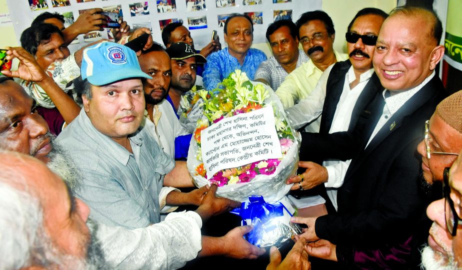 Newly-elected President and General Secretary of Jananetri Sheikh Hasina Parishiad of Dhaka City South Md Shah Alam Swapan and Md Monir Hossain Howlader greeting central leaders of the organisation as they got approval of their committee yesterday.