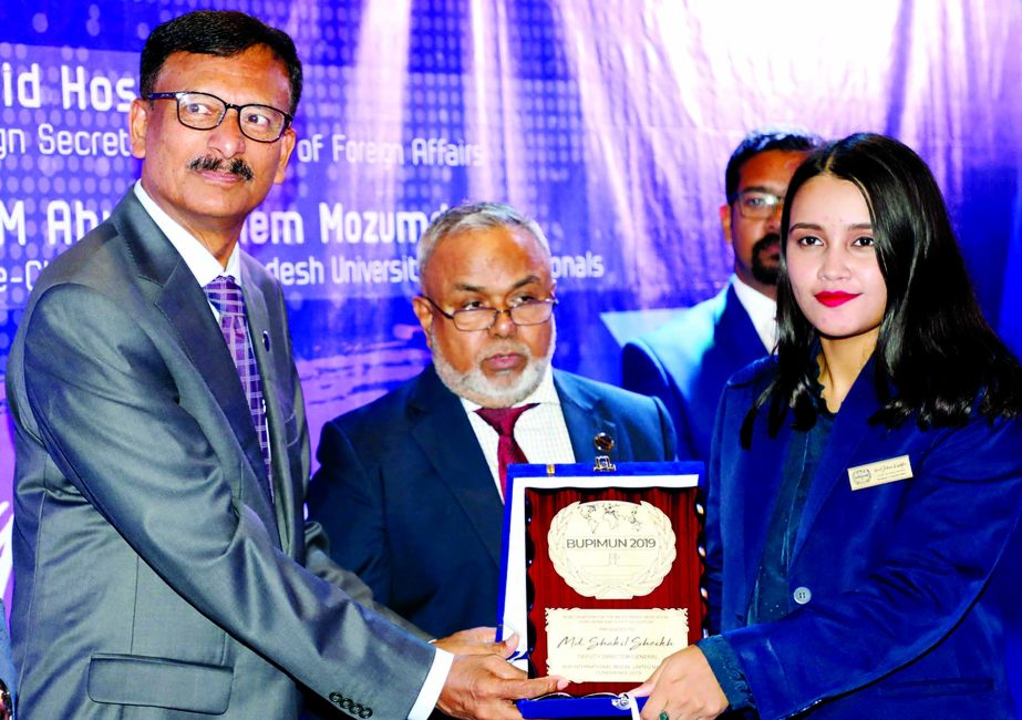 Former Foreign Secretary M Touhid Hossain distributing prizes as Chief Guest among the representatives attended at BUP International Model Institute Nations Conference on Saturday. Photo : ISPR