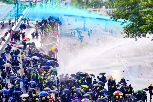 Water cannon and tear gas were fired at protesters hurling bricks and molotovs.