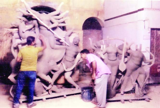 BAGERHAT: Potters are seen busy to complete idols of the Goddess Durga and other deities at local Harishava Mondir Puja pandel.