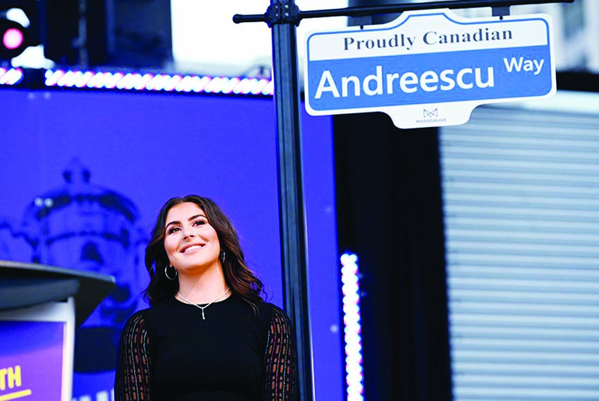 U.S. Open tennis champion Bianca Andreescu with a sign naming a street for Andreescu at the "She The North" celebration rally in Mississauga, Ontario, Canada on Sunday.