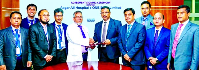 Md. Monzur Mofiz, AMD of ONE Bank Limited and Prof. Dr. Zabrul SM Haque, CEO of Asgar Ali Hospital, exchanging an agreement signing document at the banks head office in the city recently. Under the deal, the hospital will provide up to 10 per cent discoun