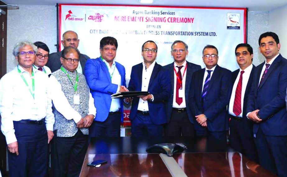 Mashrur Arefin, CEO of City Bank Limited and Sheikh Tanvir Ahmed, Managing Director of Sundarban Express Transportation System Limited (SETS), exchanging an agreement signing document at the banks head office in the city on Wednesday to explore the opport