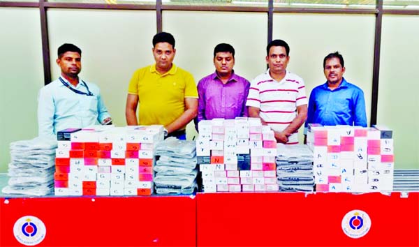 A preventive team led by Sazzad Hossain, Senior Assistant Commissioner of Dhaka Customs House in a drive arrested five smugglers with huge mobile sets, laptops, Sarees and gold at Hazrat Shahjala International Airport on Wednesday.