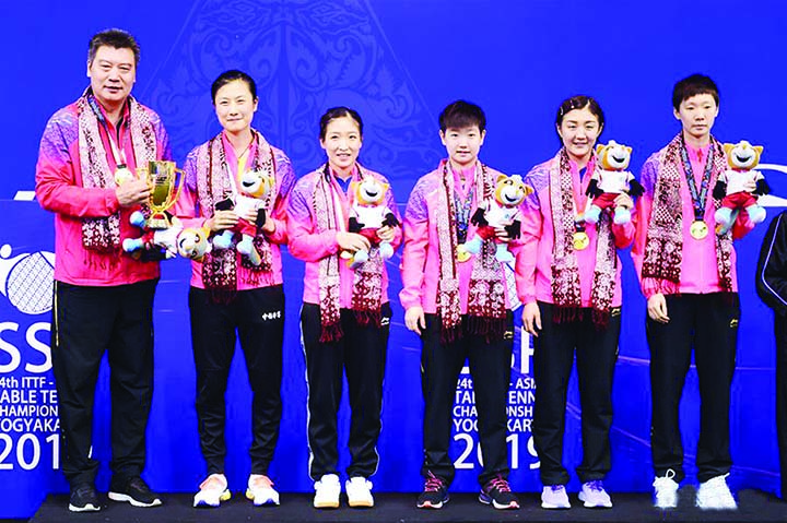 Members of China Women's team pose for photo during the award ceremony after winning the women's teams final match between China and Japan at the 2019 Asian Table Tennis Championships in Yogyakarta, Indonesia on Tuesday.