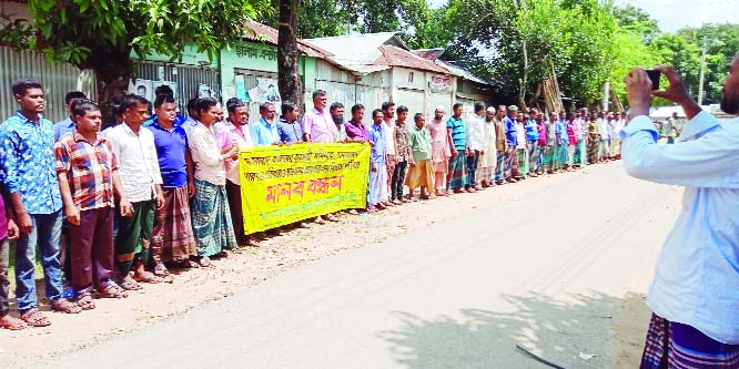 SHERPUR: Locals formed a human chain at Jhenaigathi Upazila protesting attack on businessman Momin on Wednesday.