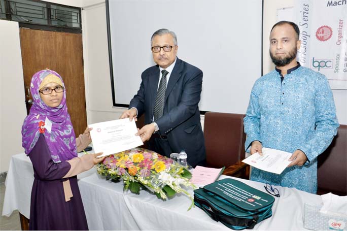 Prof Dr Saiful Islam, Vice-Chancellor, BUET handes over certificates among the participants of a 3 day long training course on 'Re-Engineering and Upgradation of Machinery in Light Engineering Industries Sector' at IAT seminar room on Monday.