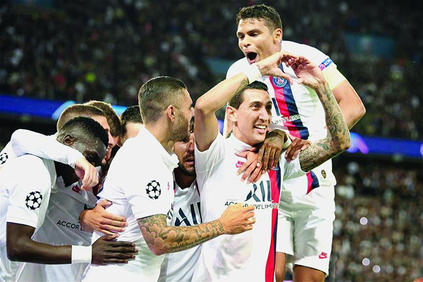 Angel Di Maria (front ) of PSG celebrates his goal with his teammates during their Group A match between Paris Saint-Germain and Real Madrid at the UEFA Champions League in Madrid, Spain on Wednesday.