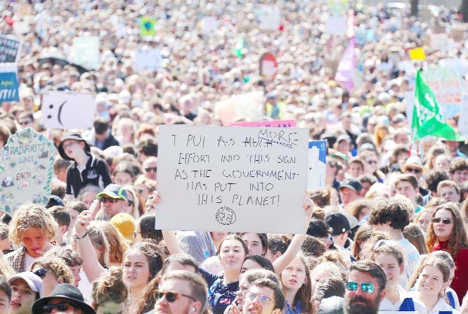 Protesters from Paris to Sydney rally to save the planet.