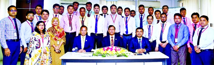 Md. TariqulAzam, AMD of Standard Bank Limited, poses for photograph with the participants of a day-long training on "MCSME Portfolio Management & Reporting" for Desk Credit Officers at its Training Institute in the city recently. Md. Moshiur Rahman, EVP