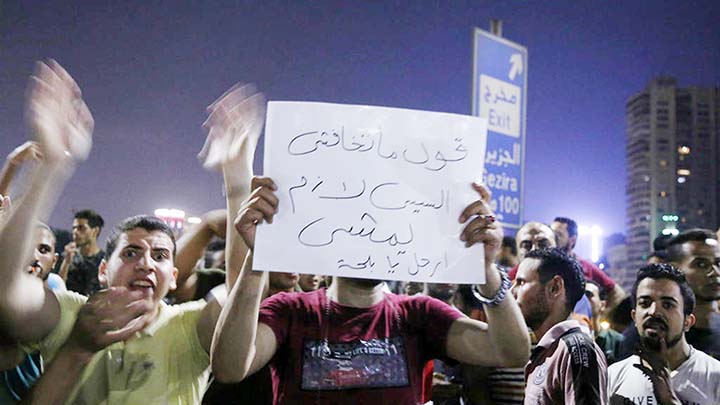 Egyptian protesters shout slogans as they take part in a protest calling for the removal of President Abdel Fattah-e-Sisi in Cairo's downtown on Friday.