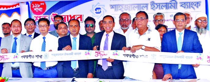 M. Shahidul Islam, Managing Director of Shahjalal Islami Bank Limited, inaugurating it's 128th branch at Gafargaon in Mymensingh on Sunday. Md. Shamsuddoha Shimu, Head of Public Relations, other senior officials of the bank and local elites were also pre