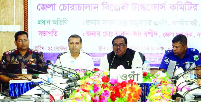 NAOGAON: Food Minister Sadhan Chandra Majumder MP speaking at the special meeting of Taskforce on anti- smugglings at DC Conference Room in Naogaon as Chief Guest on Sunday.
