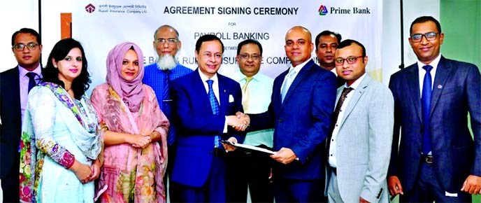 Mamur Ahmed, Head of Consumer Sales & Collection of Prime Bank Limited and PK Roy, Managing Director of Rupali Insurance Company Limited, exchanging an agreement signing document on "Prime Payroll" at the banks head office in the city recently. Under th