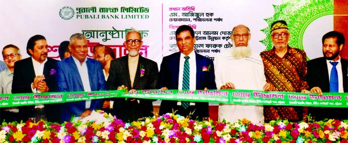 M Azizul Huq, Chairman, Board of Directors of Pubali Bank Limited, inaugurating its Islamic Banking Window at CDA Corporate branch in Chattogram recently. Fahim Ahmed Faruk Chowdhury, Director, Md. Abdul Halim Chowdhury, Managing Director and local elites