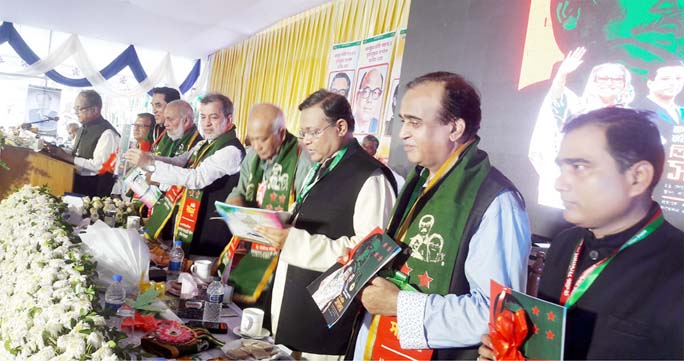 Information Minister Dr Hasan Mahmud and former Minister Engineer Mosharraf Hossain MP unveiling the unwrapping ceremony of book marking the triennial conference of Raozan Upazila Awami League at Raozan Govt College Maidan on Saturday.