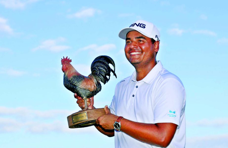 Colombia's Sebastian Munoz poses with the trophy after winning his first US PGA Tour title in a playoff at the Sanderson Farms Championship on Sunday.