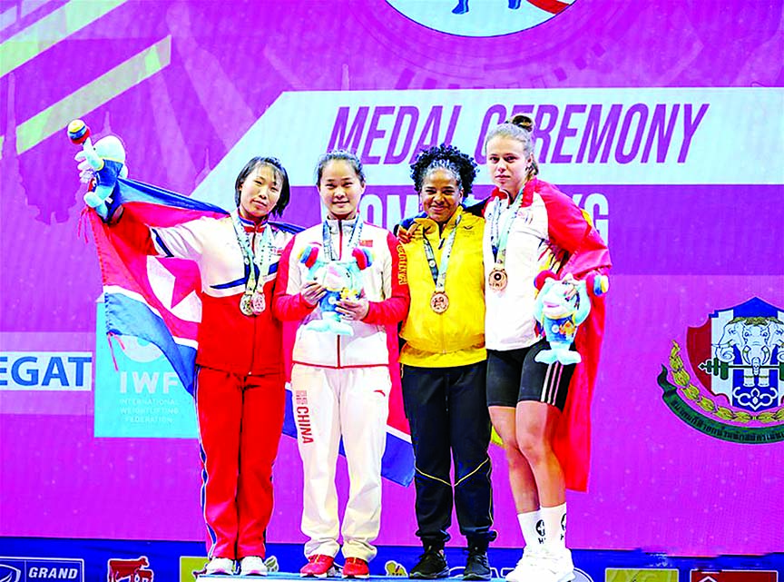 Deng Wei (2nd left) of China poses for group photo with other medal winners after the women's weightlifting 64kg event at the 2019 World Weightlifting Championships held at Pattaya, Thailand on Sunday.