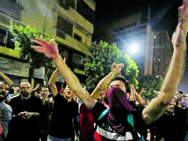 Small groups of protesters gather in central Cairo shouting anti-government slogans in Cairo, Egypt on Monday.