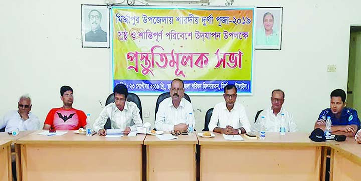 MIRZAPUR (Tangail): Md Moinul Huq, Acting UNO speaking at a meeting on preparation and security of Durga Puja at Parishad Auditorium on Monday.