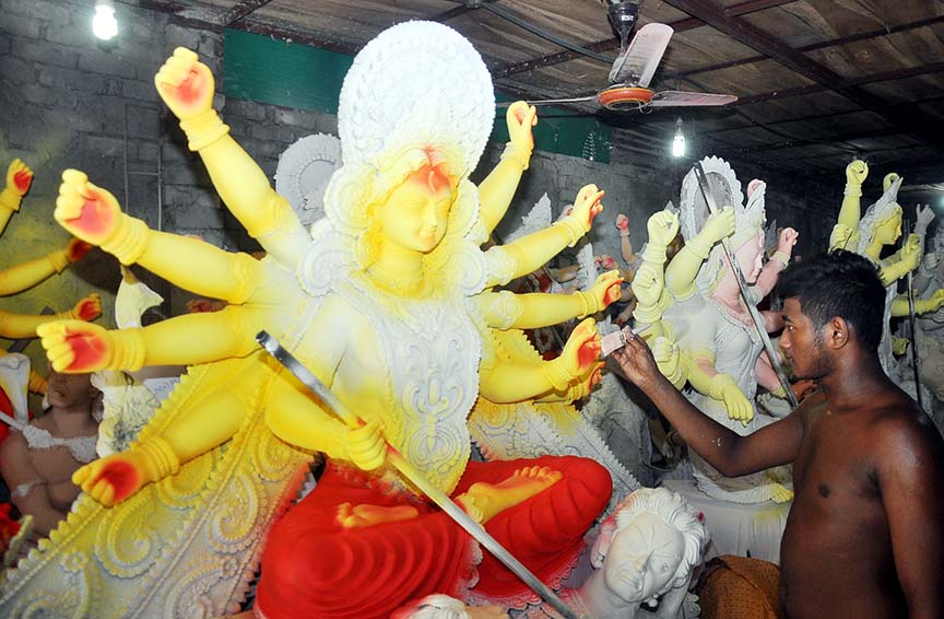 Idol makers at Port City passing busy time ahead of Durga Puja. This picture was taken from Sadarghat area yesterday.