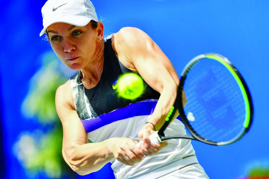 Simona Halep of Romania, hits a return to Barbora Strycova of Czech Republic, during the Wuhan Open Tennis Championship in China on Tuesday.