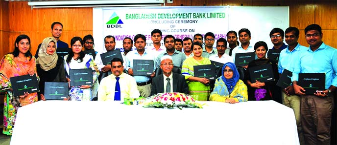 Md. Abdul Matin, Managing Director (in-charge) of Bangladesh Development Bank Limited, poses for photograph with the participants of a foundation training course at the bank's Training Institute in the city recently. Concerned officials were also present