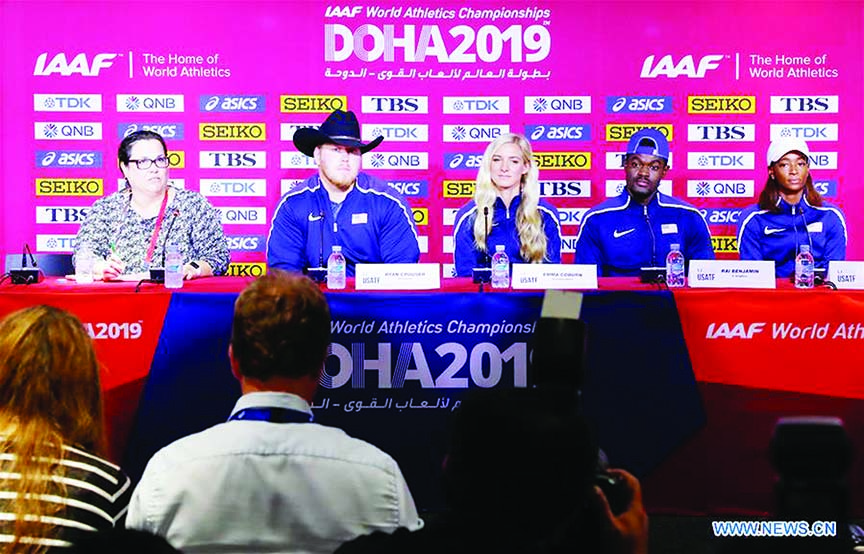 Ryan Crouser (2nd left), Emma Coburn (center), Rai Benjamin (2nd right) and Dalilah Muhammad (1st right) of the United States attend a press conference of the U.S track and field team for the 2019 IAAF World Championships in Doha, Qatar o
