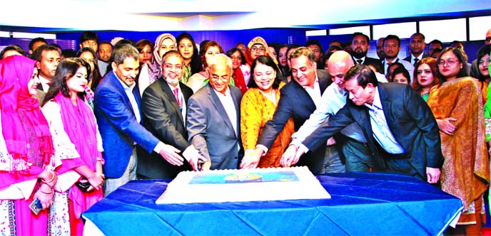 Tapan Chowdhury, Sponsor Director along with Nihad Kabir, Syed Afzal Hasan Uddin and Dilip Kajuri, patrons of Guardian Life Insurance Company Limited, inaugurating its 6th Anniversary through cutting a cake at its head office in the city recently. Syed Ak