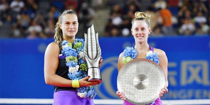 Aryna Sabalenka of Belarus (left) poses with the winner's trophy alongside runner-up Alison Riske of the US (right) after their women's singles final match at the Wuhan Open tennis tournament in Wuhan on Saturday.
