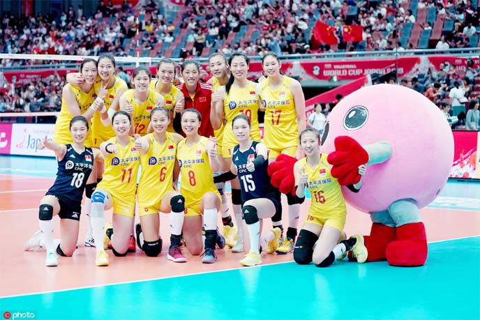 Players of China, pose for photo after winning the match between China and Serbia at the 2019 FIVB Women's World Cup in Osaka, Japan on Saturday.