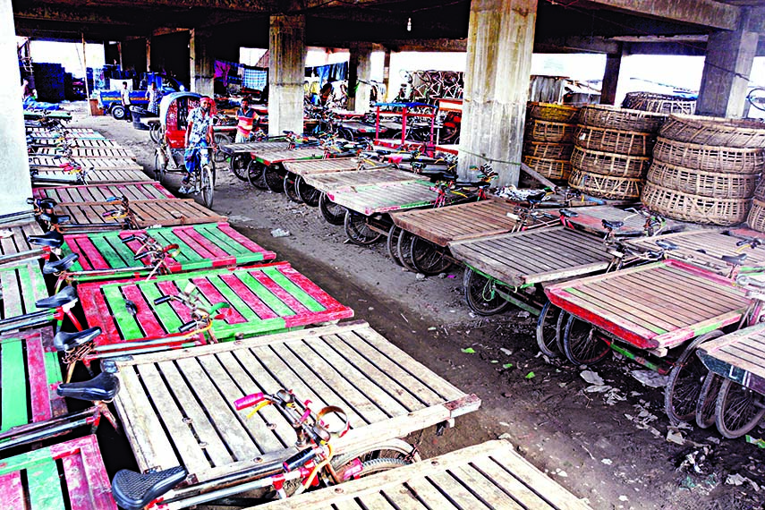 Kitchen market being built at Jatrabari in city by Dhaka South City Corporation (DSCC) lying abandoned for seven years and now turned into a rickshaw-van garage causing an extinction threat.