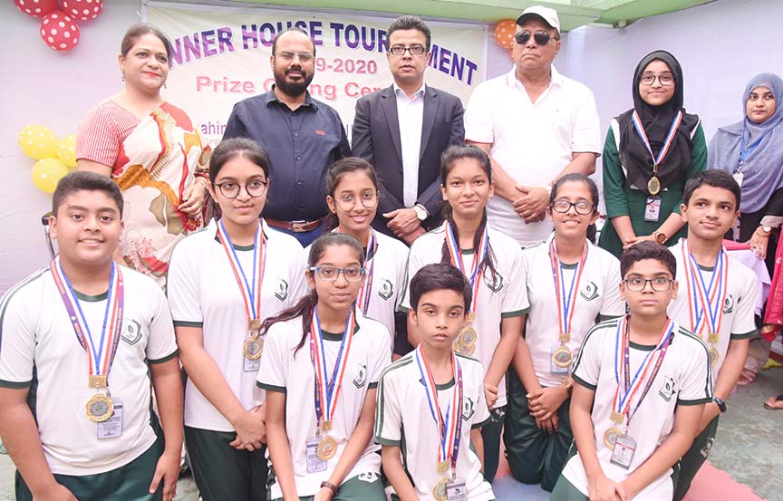 The winners of the Inter-House Sports Tournament of the Green James International School with the chief guest Country Manager of Cambridge University Shaheen Reza and the teachers of Green James International School pose for a photo session at the school