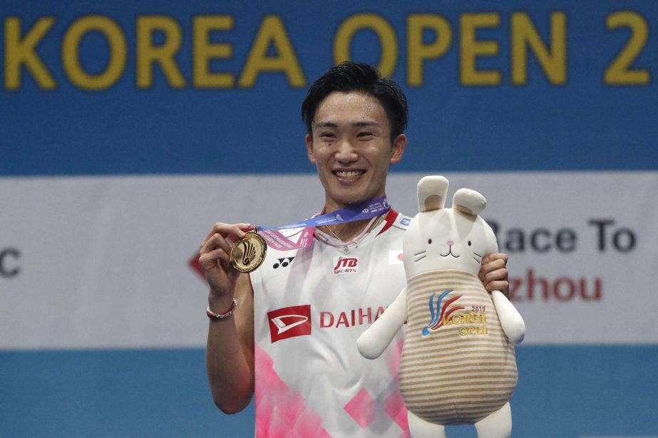 Japan's Kento Momota poses during the awards ceremony after winning against Taiwan's Chou Tien Chen during men's single final match at the Korea Open Badminton in Seoul, South Korea on Sunday.