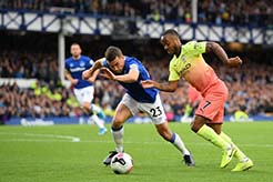 Raheem Sterling( right) of Manchester City battles for possession with Seamus Coleman of Everton during the Premier League match between Everton FC and Manchester City at Goodison Park in Liverpool, United Kingdom on Saturday.