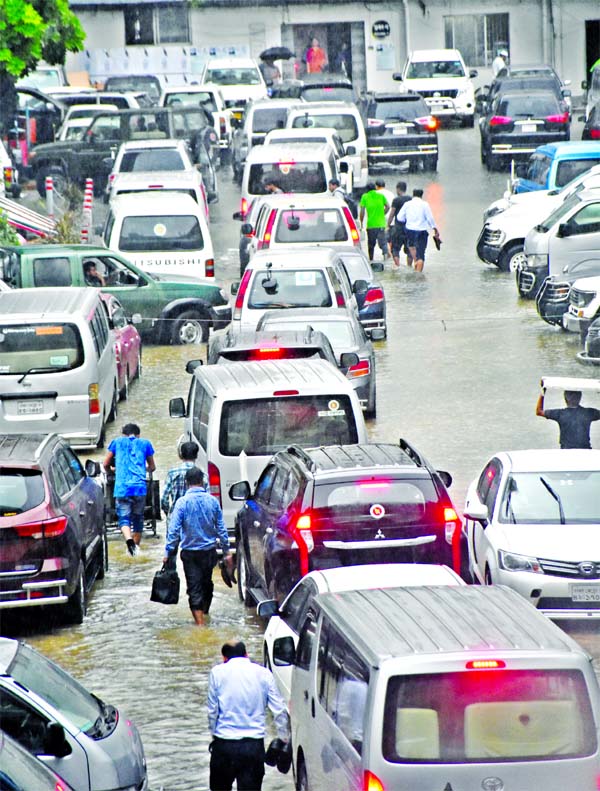 Poor drainage system of Dhaka has once again become evident with streets and key government establishments getting flooded by incessant rains since Sunday noon. The photo shows that a portion of Bangladesh Secretariat compound goes under water after the r