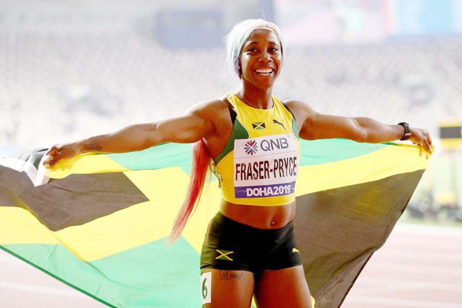 Shelly-Ann Fraser-Pryce of Jamaica celebrates winning the women's 100 metres final during day three of 17th IAAF World Athletics Championships Doha 2019 at Khalifa International Stadium in Doha, Qatar on Sunday.