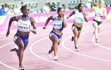 (From left to right) Dina Asher-Smith of Great Britain, Dezerea Bryant of the United States, Tynia Gaither of Bahamas and Jessica-Bianca Wessolly of Germany, compete in a women's 200 meter heat at the World Athletics Championships in Doha, Qatar on