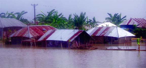 MADHUKHALI (Faridpur): Some three hundred families are marooned at Kamarkhali Union in Madhukhali Upazila as water level of Madhumati and Gorai rivers have been raised . This snap was taken yesterday.