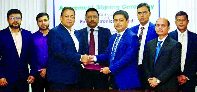 Md. Kamruzzaman, Head of Retail Banking of ONE Bank Limited and Md. Zahidul Kabir, Head of Treasury & Credit Management of Fair Electronics Limited (FEL), exchanging an agreement signing document at the bank head office in the city on Tuesday. Under the d