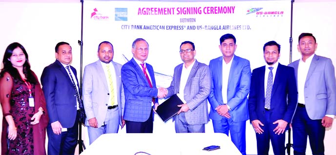 Md. Zafrul Hasan, Head of Digital Financial Services of City Bank Limited and Md. Shafiqul Islam, Head of Marketing & Sales of US-Bangla Airlines, exchanging an agreement signing document at the bank's head office in the city recently. Under the deal, Am