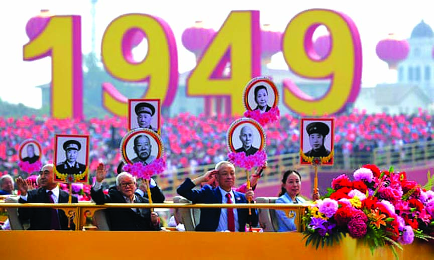 Relatives of revolutionary martyrs take part in a parade in Tiananmen Square in Beijing to mark the 70th anniversary of the founding of the People's Republic of China.