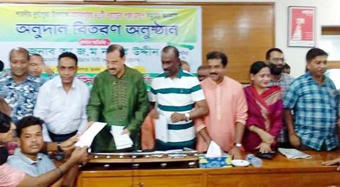 CCC Mayor AJM Nasir Uddin distributing donation among the people of Hindu Community at Chattogram City Corporation Conference Room as Chief Guest on Monday.