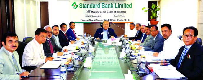 Kazi Akram Uddin Ahmed, Chairman, Board of Directors of Standard Bank Limited, presiding over its 318th meeting at the bank's head office in the city on Thursday. Mohammed ShamsulAlam, Vice- Chairman, Kamal Mostafa Chowdhury, Ashok Kumar Saha, Ferozur R