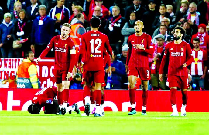 Liverpool's Sadio Mane (left) celebrates after scoring during the UEFA Champions League Group E match between Liverpool and Salzburg in Liverpool, Britain on Wednesday.