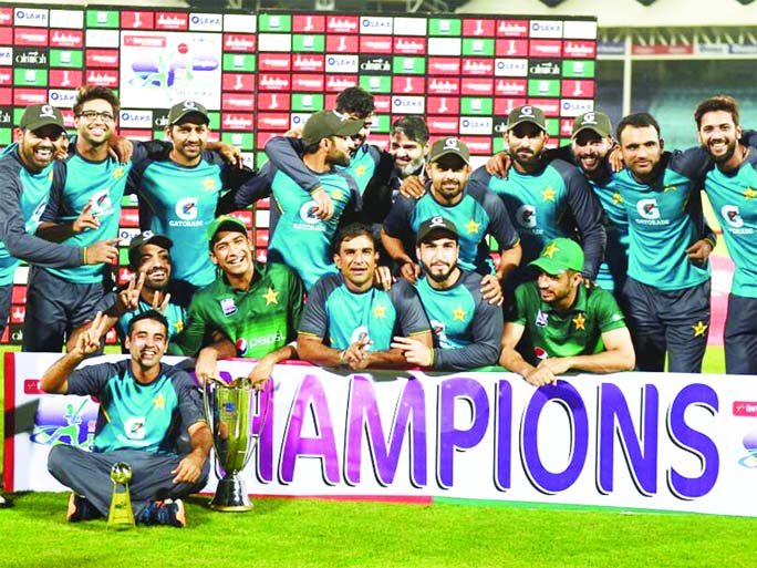 Pakistan's cricketers pose for a photograph with their trophy after winning the third and final One Day International (ODI) cricket match between Pakistan and Sri Lanka in Karachi on Wednesday.