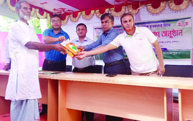 JAMALPUR: Aminul Islam, Deputy Director, District Agriculture Department distributing seeds of vegetables among the marginal farmers on Tuesday .