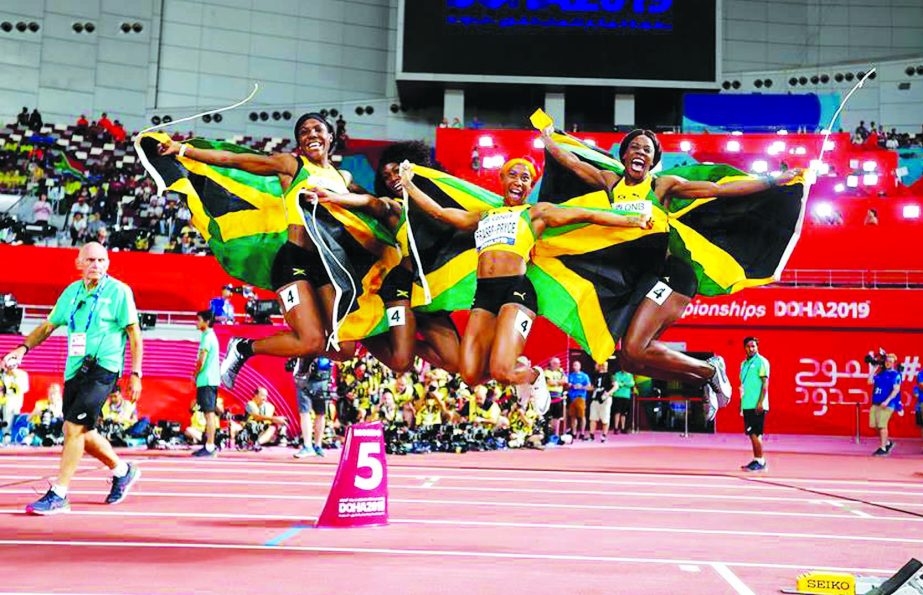 Jonielle Smith, Natalliah Whyte, Shelly-Ann Fraser-Pryce and Shericka Jackson of (from left to right) Team Jamaica celebrate after the women's 4X100m relay final at the 2019 IAAF World Athletics Championships in Doha, Qatar on Saturday.