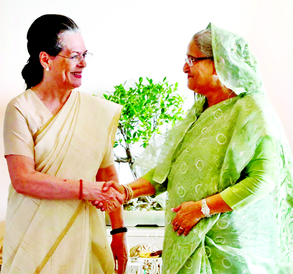 Prime Minister Sheikh Hasina shakes hand with Congress President Sonia Gandhi during a meeting in New Delhi on Sunday: